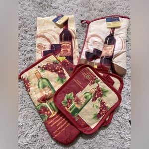 Wine themed Oven Mitts (2), pot holders (2) and 1 kitchen towel